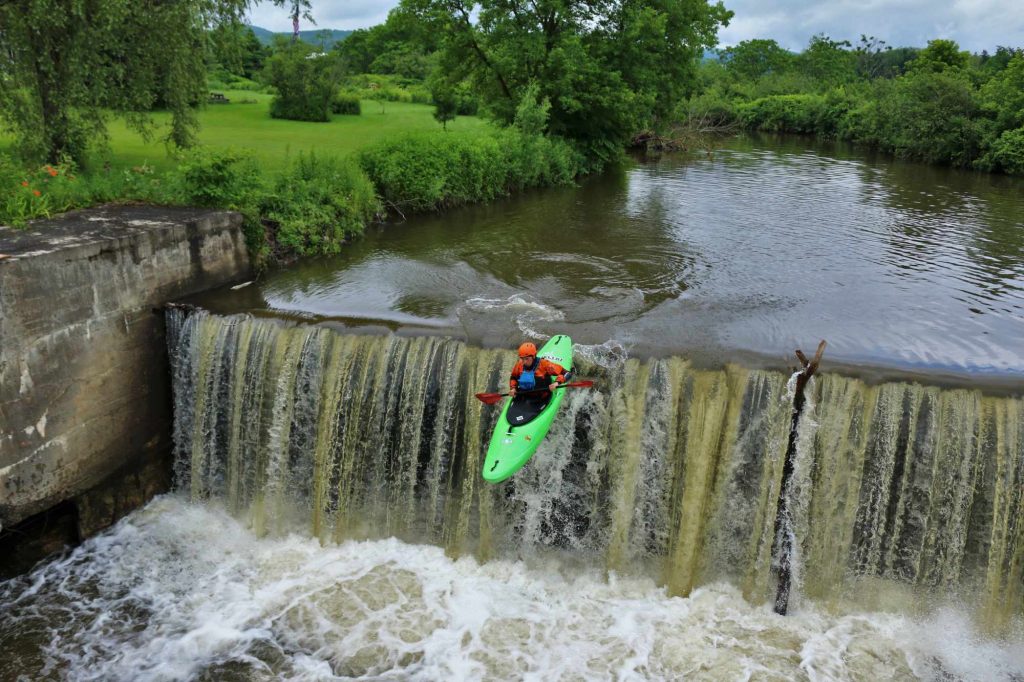 Alex Terry runs a dam waterfall on the Browns River Vermont Whitewater Kayaking